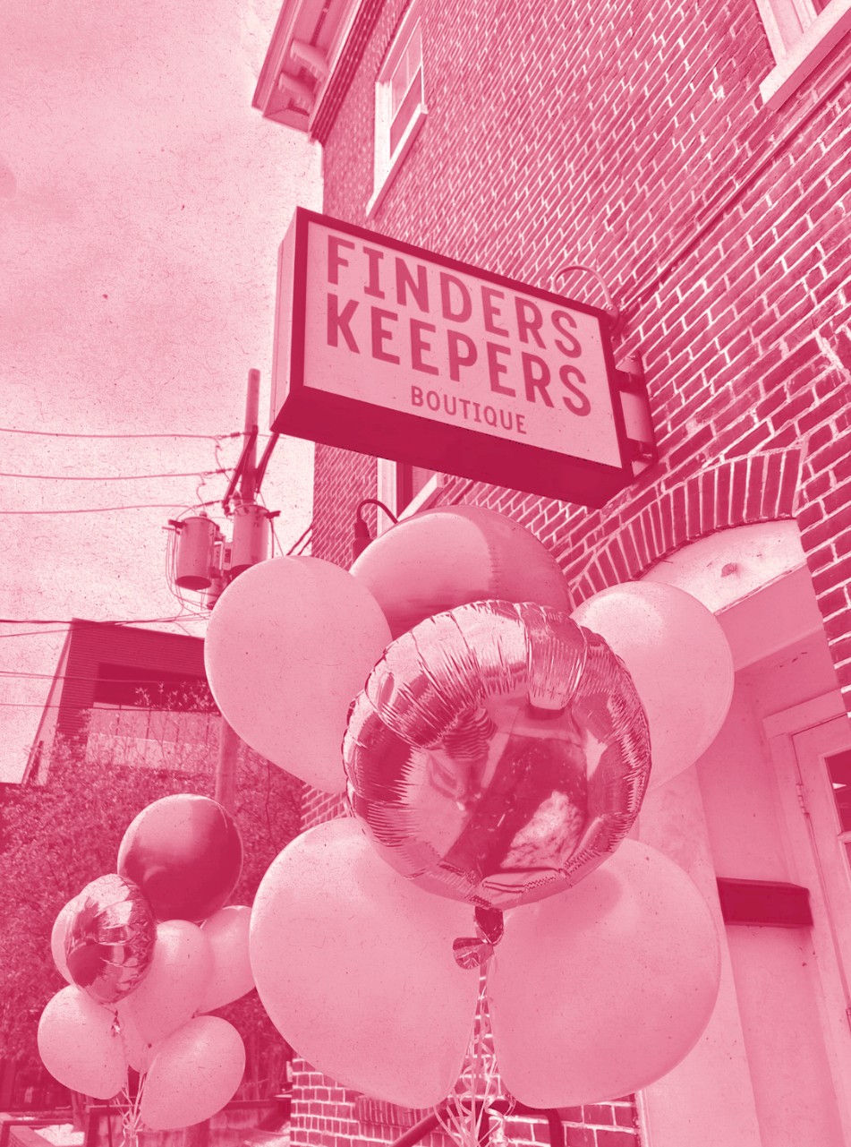 The Finders Keepers sign on East Main Street with pink balloons